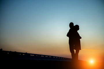 Silhouette couples in love the sky.