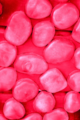 red wall with stones, decorative trim, construction, repair, texture, background