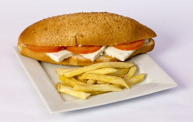 Cheeseburger and fries on restaurant table