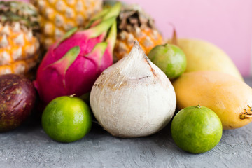 White coconuts from Thailand on a pink background