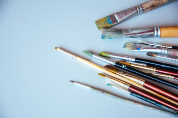 Obraz premium Paint brushes on a table. Painting concept.