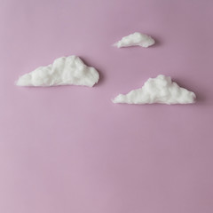 clouds on light purple background. Creative concept. Flat lay.