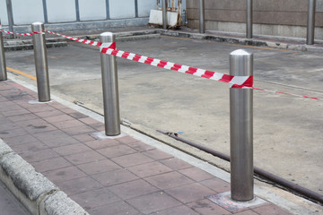 steel bollards with red and white tape with red and white tape