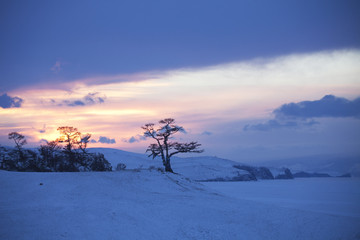 Cape Burhan on Baikal Lake. Sunset. Winter landscape