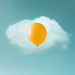 Deurstickers Yellow balloon with white cloud on blue sky in shape of an egg. Food concept. © Zamurovic Brothers