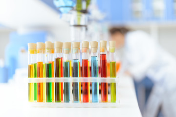 Close-up view of test tubes with reagents on white table in laboratory
