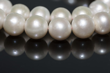 Pearl necklace on a dark background