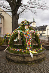 Easter fountain. Osterbrunnen. Traditional german easter eggs outdoor decoration. 
