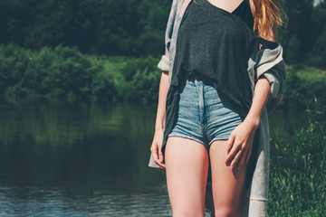 Young Woman walking at river wearing fashion jeans shorts hipster style Lifestyle and Travel beauty...