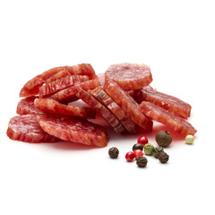 Salami smoked sausage slices and peppercorns isolated on white background cutout