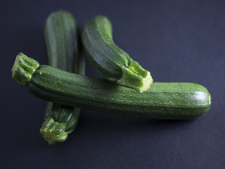 Zucchinis isolated on black