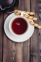 cup with a drink and sweet tubules, top view