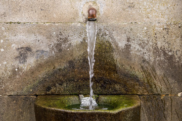 source of drinking water in the stone close up