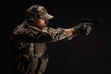 Portrait soldier or private military contractor holding sniper rifle. war, army, weapon, technology...