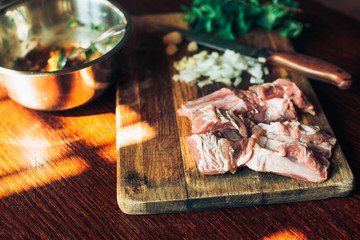 Raw fresh Lamb Meat ribs and seasonings on wooden background.