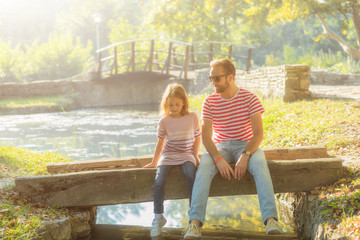 Father and daughter enjoying in the park.