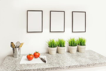 Clean kitchen counter top with fresh tomatoes