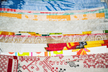 A pile of various towels made of natural linen fabric