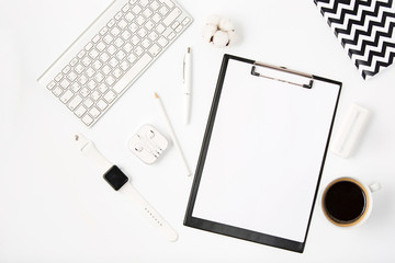 Top view of white office table with notebook