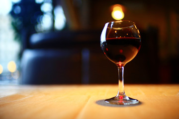 Serving a glass of red wine in a restaurant