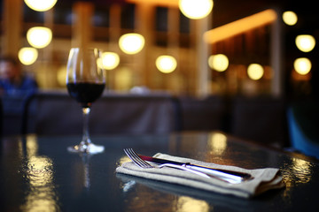 Fototapeta na wymiar Serving a glass of red wine in a restaurant