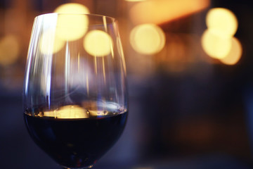 Serving a glass of red wine in a restaurant