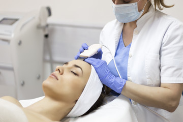 Fototapeta premium Ultrasound cavitation, face skin cleansing