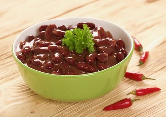 red beans in sauce on a wooden background