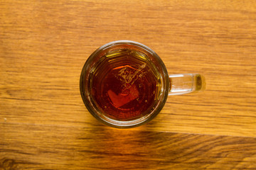 mug of beer on wooden background