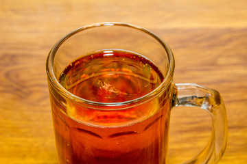 mug of beer on wooden background