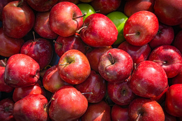 Red apples background. apples in a market stall