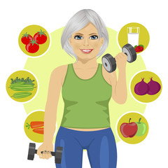elderly woman with dumbbells and variety of healthy vegetables