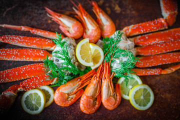 seafood on black. crab and  shrimps on dark background. delicious cooked shrimp with an...