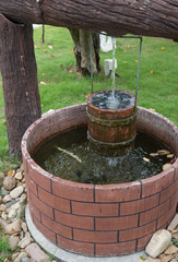 water well of stone with bucket