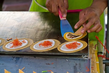 postproduction of thai crispy pancake - cream crepes on the iron pan