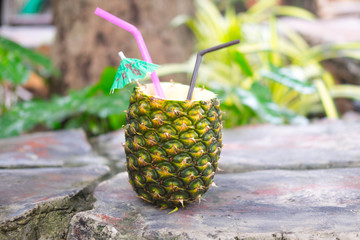 Exotic cocktail pina colada in a pineapple