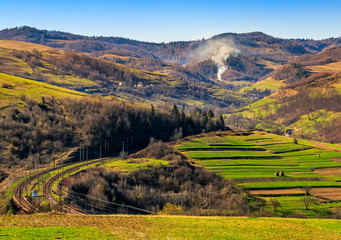 Rail road winds through mountainous rural area