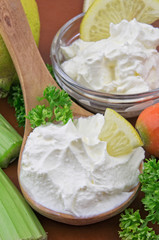 Sour cream closeup with fresh ingredients