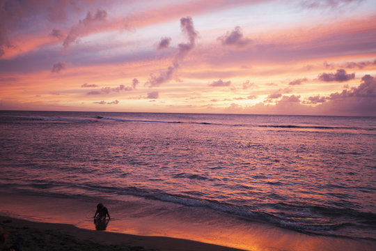 Sunset over water, Kee Beach at Haena Beach State Park; Haena, Kauai, Hawaii, United States of America