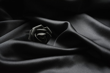 black rose on black fabric