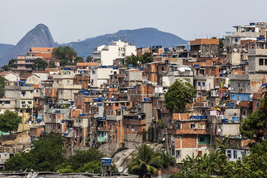 The view from Santa Teresa looking towards Sugarloaf Mountain with a favela in the foreground; Rio de Janeiro, Brazil