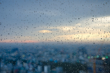 bokeh blur rain drop on glass rainy season