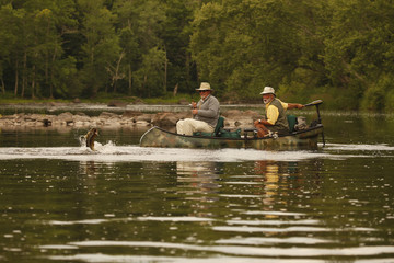 Bass Fishermen In Canoe In A River