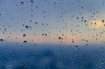 bokeh blur rain drop on glass rainy season