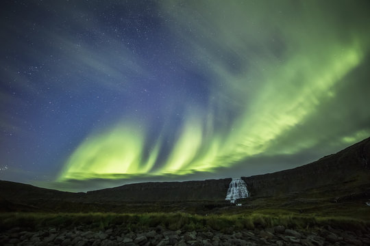 Northern lights over Dynjandi in the Westfjord region; Iceland