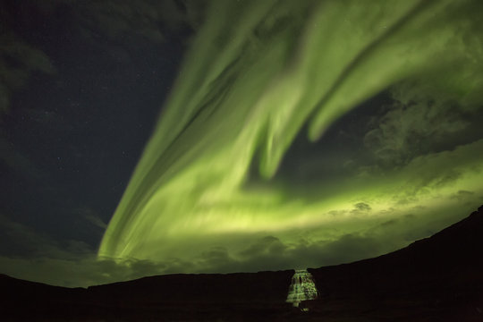 Northern lights over Dynjandi in the Westfjord region of Iceland, Dynjandi is a series of seven waterfalls; Westfjords, Iceland