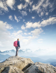 Obraz premium Tourist on mountain peak. Sport and active life concept..
