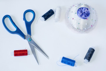 Tailoring tools are scissors needle and threads