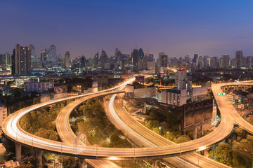 Fototapeta na wymiar Aerial view Highway interchanged with city downtown background night view
