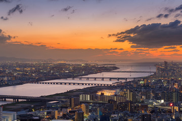 City of Osaka with river and sunset sky background, Japan